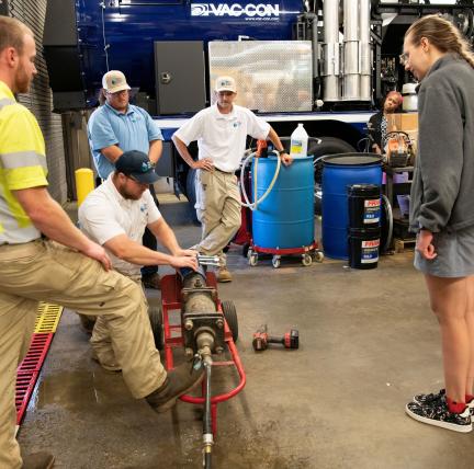 2026 Water Academy participants receive a demonstration of water main break repair.