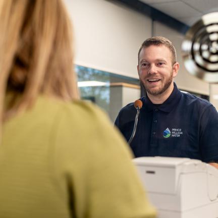 Photo: a customer service representative at a window