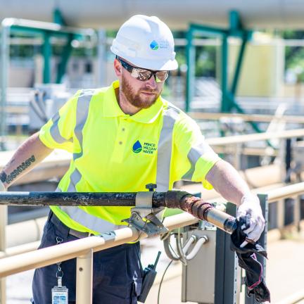 Photo: a water reclamation operator working at the facility