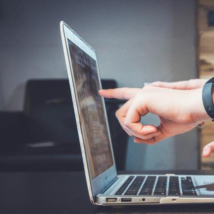 Stock Photo: Pointing at Computer