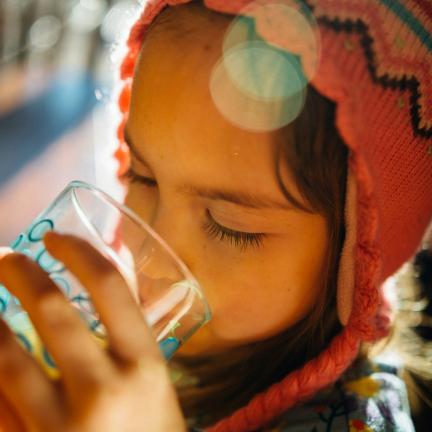 Child Drinking a Glass of Water