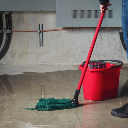 Mopping the floor after a leak or flood