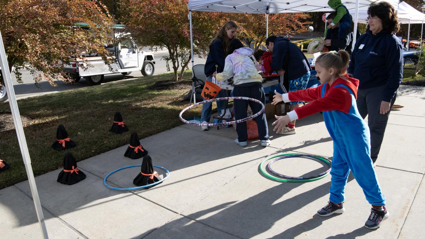 People play games outside on a sunny day