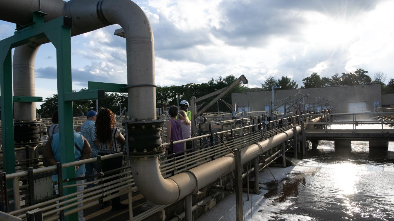 Pipes and people on a tour of a wastewater treatment facility
