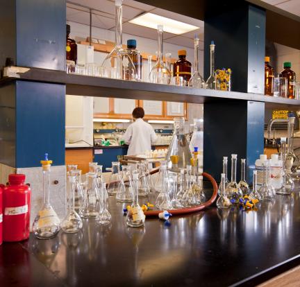 Photo: a row of laboratory bottles next to one another on a lab bench