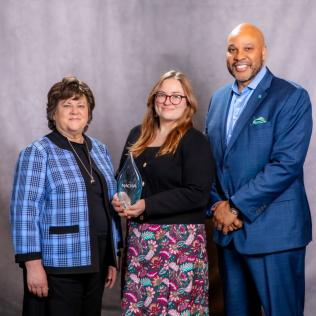 L-R, Susan D. Pekarek, NACWA’s Award Committee Chair pictured with Michelle Miranda, Community  Engagement Manager and Calvin D. Farr, General Manager & CEO, both with Prince William Water