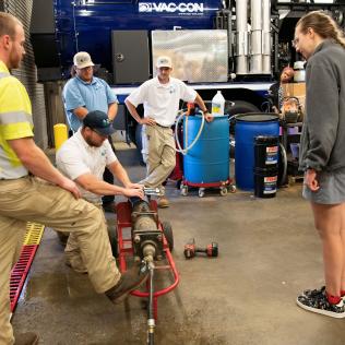 2026 Water Academy participants receive a demonstration of water main break repair.