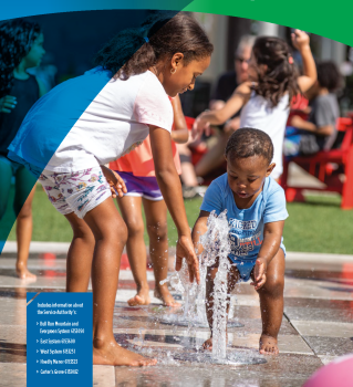 Cover of a water quality report. The cover features a photo of two kids playing in a splash pad.