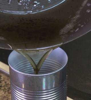 Grease being poured into a can