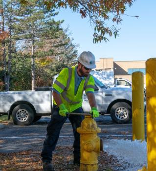 PWW crew member opening water hydrant