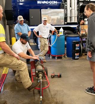2026 Water Academy participants receive a demonstration of water main break repair.