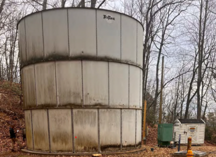 A large, aged water tank.