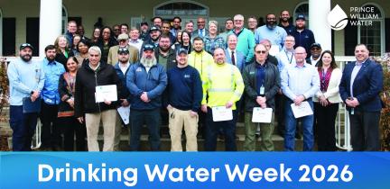 A group photo of Prince William Water employees with a Drinking Water Week banner across the bottom
