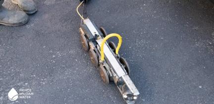 A small robot on four wheels used to scope sewer lines