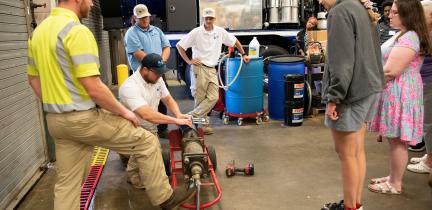 2026 Water Academy participants receive a demonstration of water main break repair.