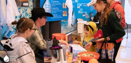 Children had fun trick-or-treating between tables at the 2026 Trick or Treatment event.