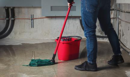 Mopping the floor after a leak or flood