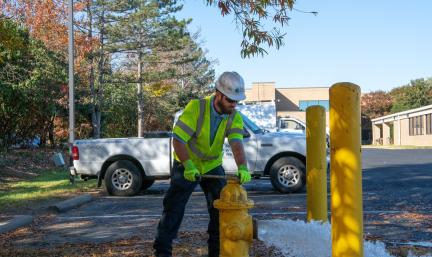 PWW crew member opening water hydrant