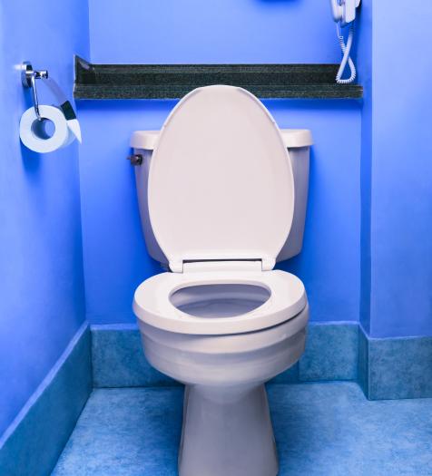 Photo: a toilet in a blue bathroom
