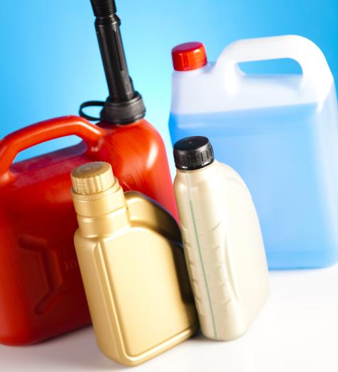 Photo: jugs of car-related logos like oils, antifreeze and gasoline