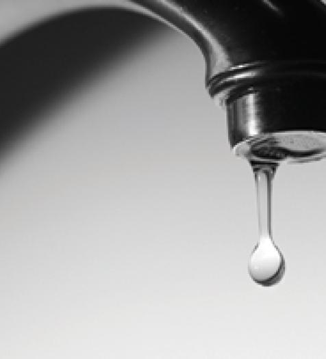 Photo: a faucet dripping lightly