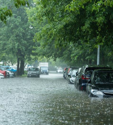 Photo: a flooded parking lot with cars